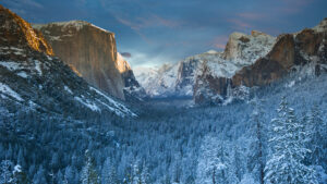 Photo of a sunset illuminating a granite cliff in Yosemite National Park