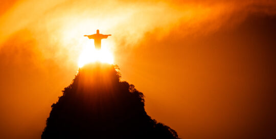 Picture of a statue of Jesus on a mountain
