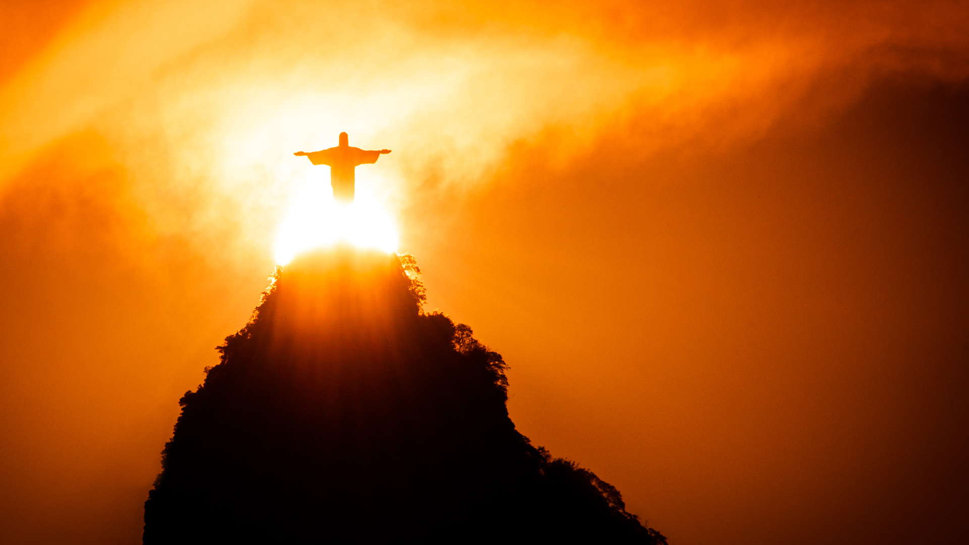 Picture of a statue of Jesus on a mountain