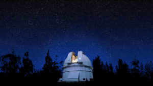 Photo of an observatory at night under a starry sky