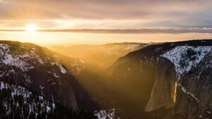 Photo of a sunset illuminating a granite cliff in Yosemite National Park